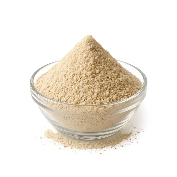 Glass bowl filled with Lemon Aspen Powder on a white background